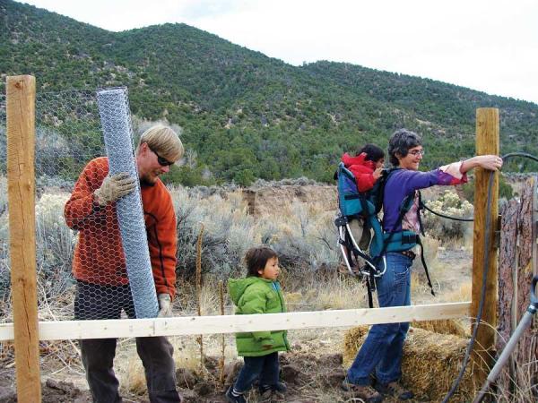 Treska’s dad, Falko, and their neighbor Marcy and her two boys building the chicken coop.